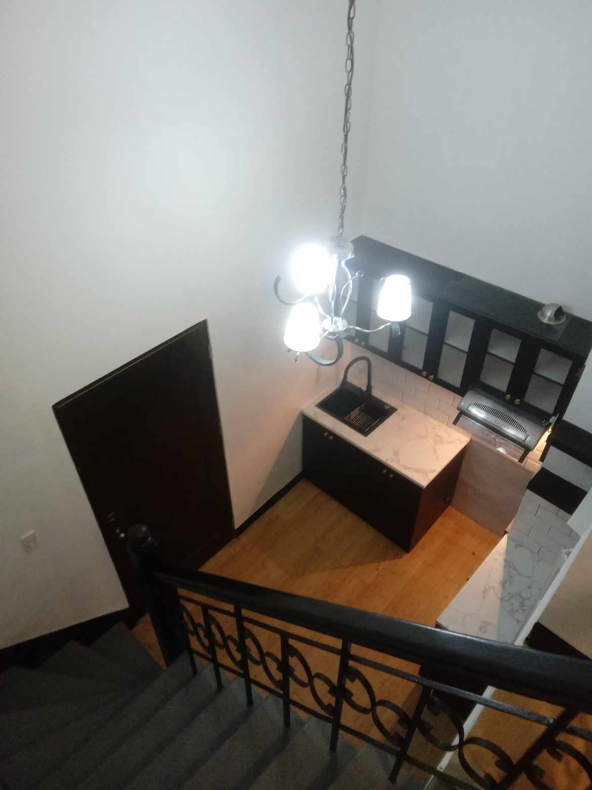 Loft-style condo with mezzanine and kitchenette