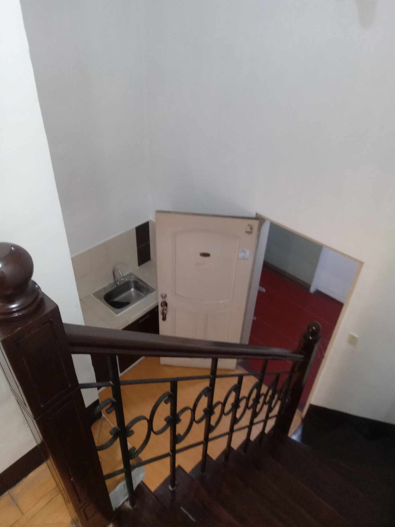 Mezzanine condo unit with compact kitchen and private bath